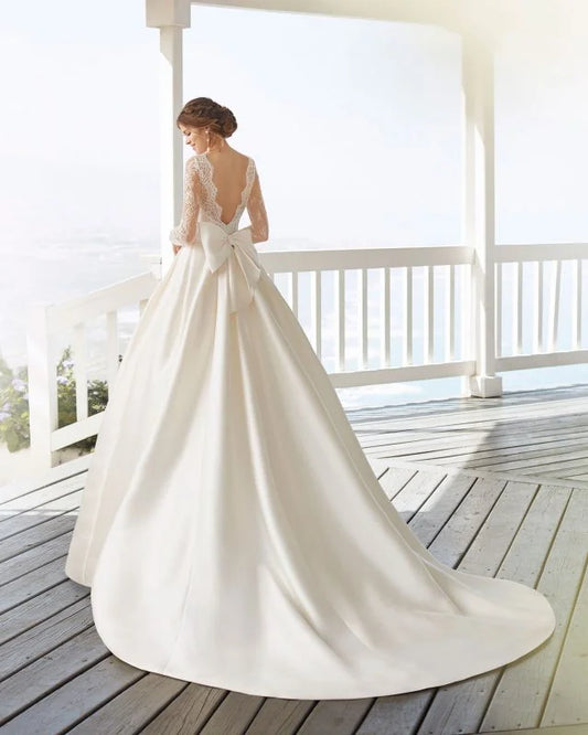 Ethereal A-Line Wedding Gown with Long Sleeves, Delicate Illusion Neckline, and Exquisite Lace Detailing for a Graceful and Timeless Bridal Look