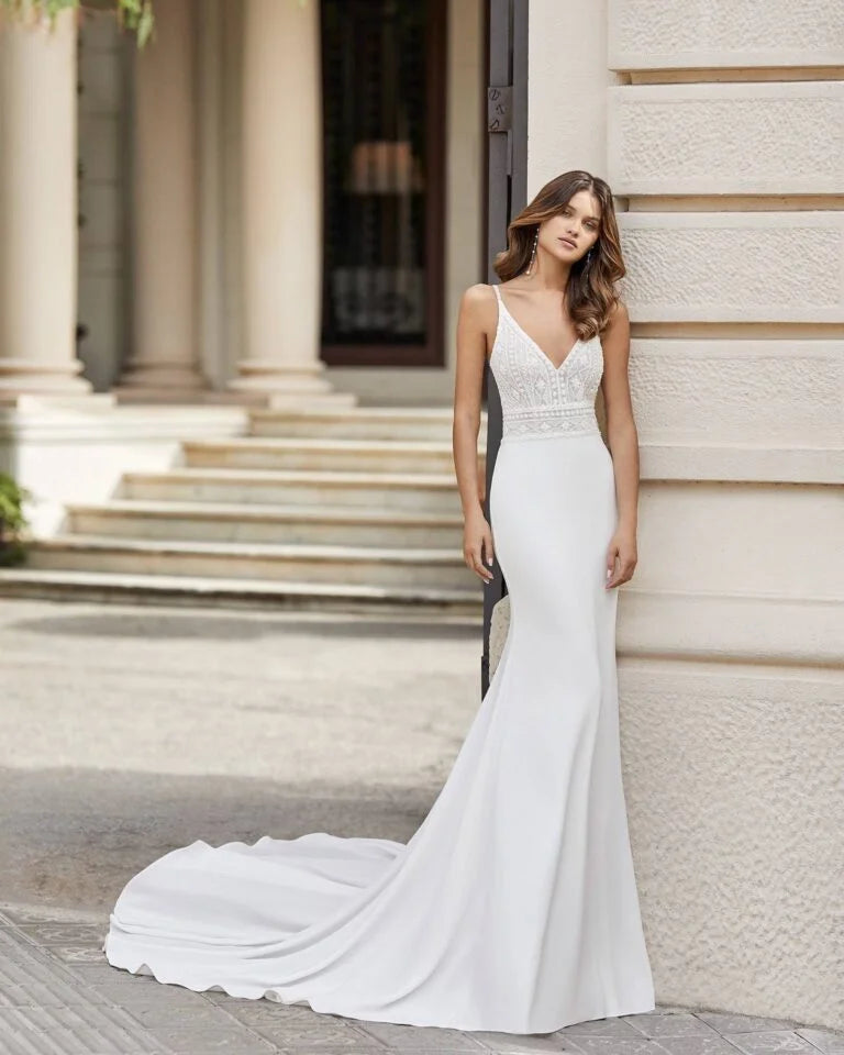 Sleek Sheath Wedding Gown with Spaghetti Straps, Elegant V-Neckline, and Intricate Lace Detailing for a Romantic and Timeless Bridal Look