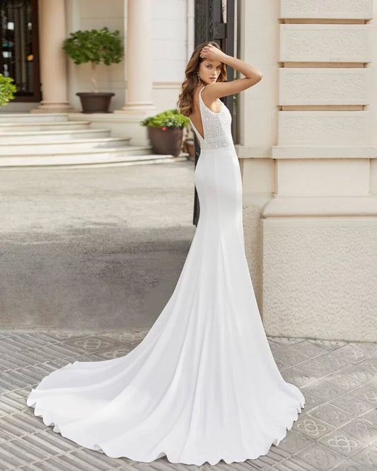 Sleek Sheath Wedding Gown with Spaghetti Straps, Elegant V-Neckline, and Intricate Lace Detailing for a Romantic and Timeless Bridal Look