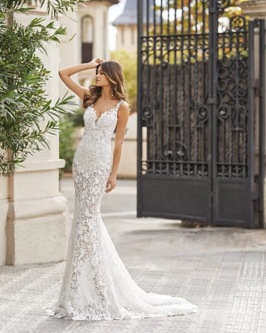 Sophisticated Mermaid Wedding Gown with Spaghetti Straps, Elegant V-Neckline, and Delicate Lace Detailing for a Chic and Timeless Bridal Look