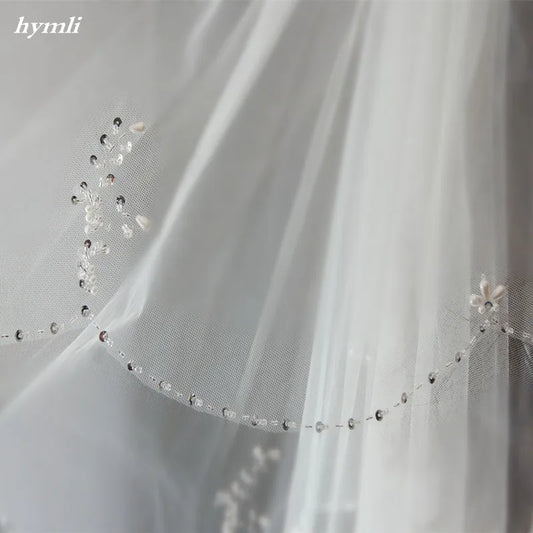Two-Tier Hand-Beaded Scalloped Edge Bridal Veil with Metal Comb: A Symphony of Craftsmanship and Bridal Splendor