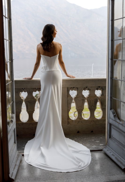 Wedding Dress of a straight silhouette with a skirt on a wrap.