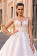 Fairytale Ball Gown Wedding Dress with Cap Sleeves, Delicate Illusion Neckline, and Exquisite Lace Detailing for a Romantic and Timeless Bridal Look