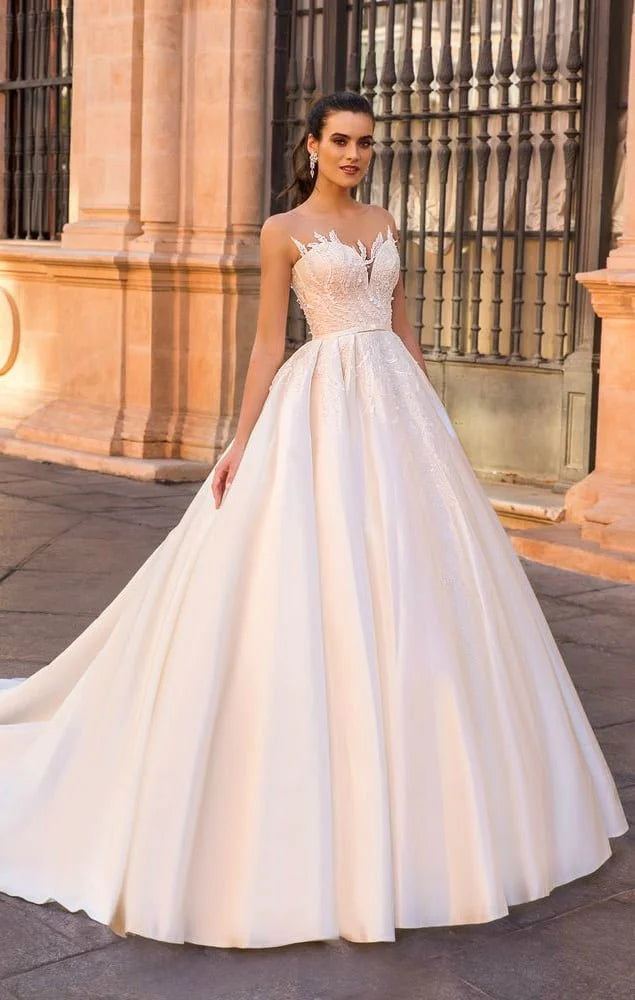 Fairytale Ball Gown Wedding Dress with Cap Sleeves, Delicate Illusion Neckline, and Exquisite Lace Detailing for a Romantic and Timeless Bridal Look