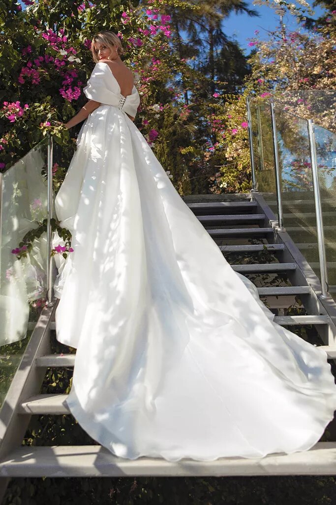 Majestic Ball Gown Wedding Dress with Off-the-Shoulder Neckline & Flattering Natural Waistline for a Regal Bridal Look