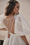 Whimsical Boho Wedding Dress with Puffy Sleeve V-Neckline, Delicate Lace Details & Flowing A-Line Silhouette for a Romantic and Effortless Bridal Look