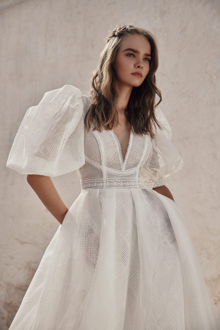 Whimsical Boho Wedding Dress with Puffy Sleeve V-Neckline, Delicate Lace Details & Flowing A-Line Silhouette for a Romantic and Effortless Bridal Look