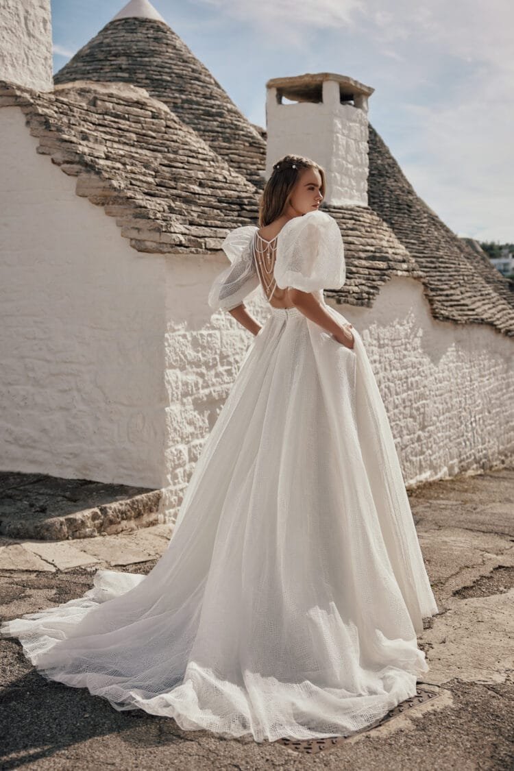 Whimsical Boho Wedding Dress with Puffy Sleeve V-Neckline, Delicate Lace Details & Flowing A-Line Silhouette for a Romantic and Effortless Bridal Look