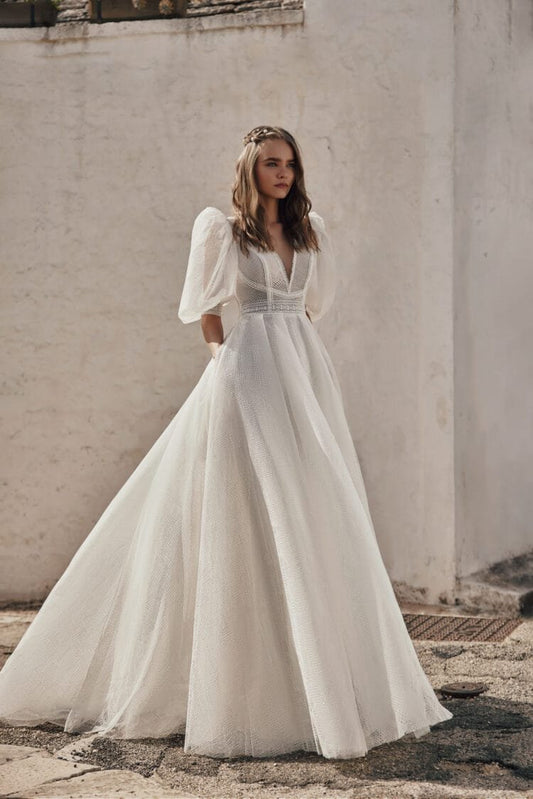 Whimsical Boho Wedding Dress with Puffy Sleeve V-Neckline, Delicate Lace Details & Flowing A-Line Silhouette for a Romantic and Effortless Bridal Look