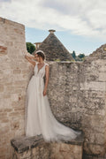 Whimsical Beach Wedding Dress with Strapless V-Neckline, Delicate Lace Details & Flowing A-Line Silhouette for a Fairy-Tale Bridal Look