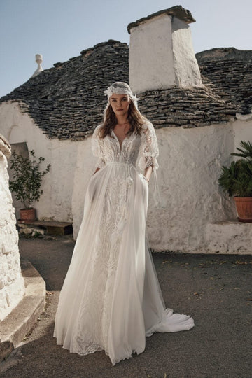 Romantic Beach Wedding Dress with Off-the-Shoulder V-Neckline, Intricate Lace Details & Flowing A-Line Silhouette for an Effortlessly Elegant Bridal Look