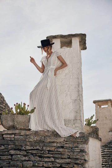 Ethereal Beach Wedding Dress with Off-the-Shoulder V-Neckline, Delicate Lace Details & Flowing A-Line Silhouette for a Romantic Bridal Look