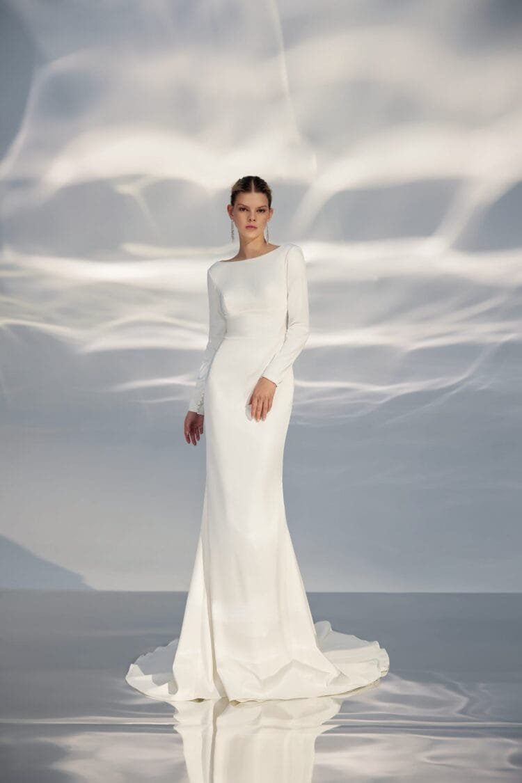 Sophisticated Minimalist A-Line Wedding Gown with Long Sleeves, Boat Neckline, and a Natural Waistline for an Elegant and Timeless Bridal Look