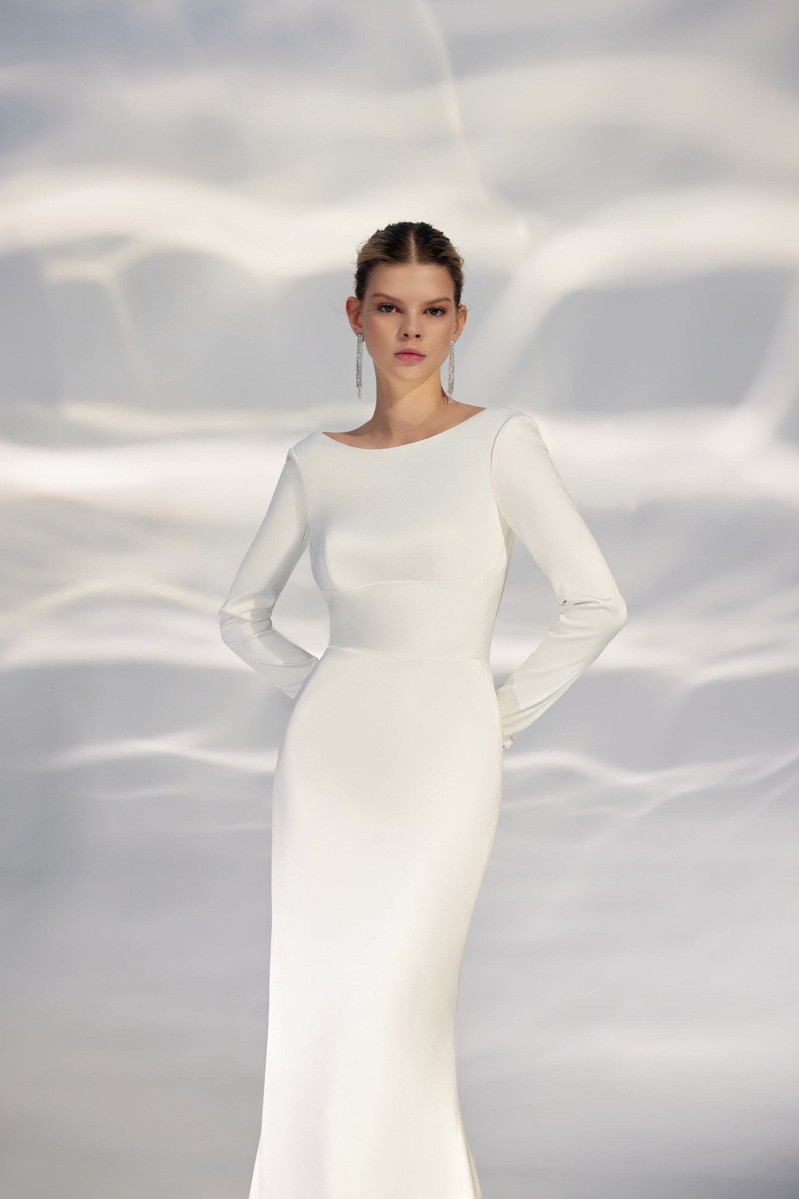 Sophisticated Minimalist A-Line Wedding Gown with Long Sleeves, Boat Neckline, and a Natural Waistline for an Elegant and Timeless Bridal Look