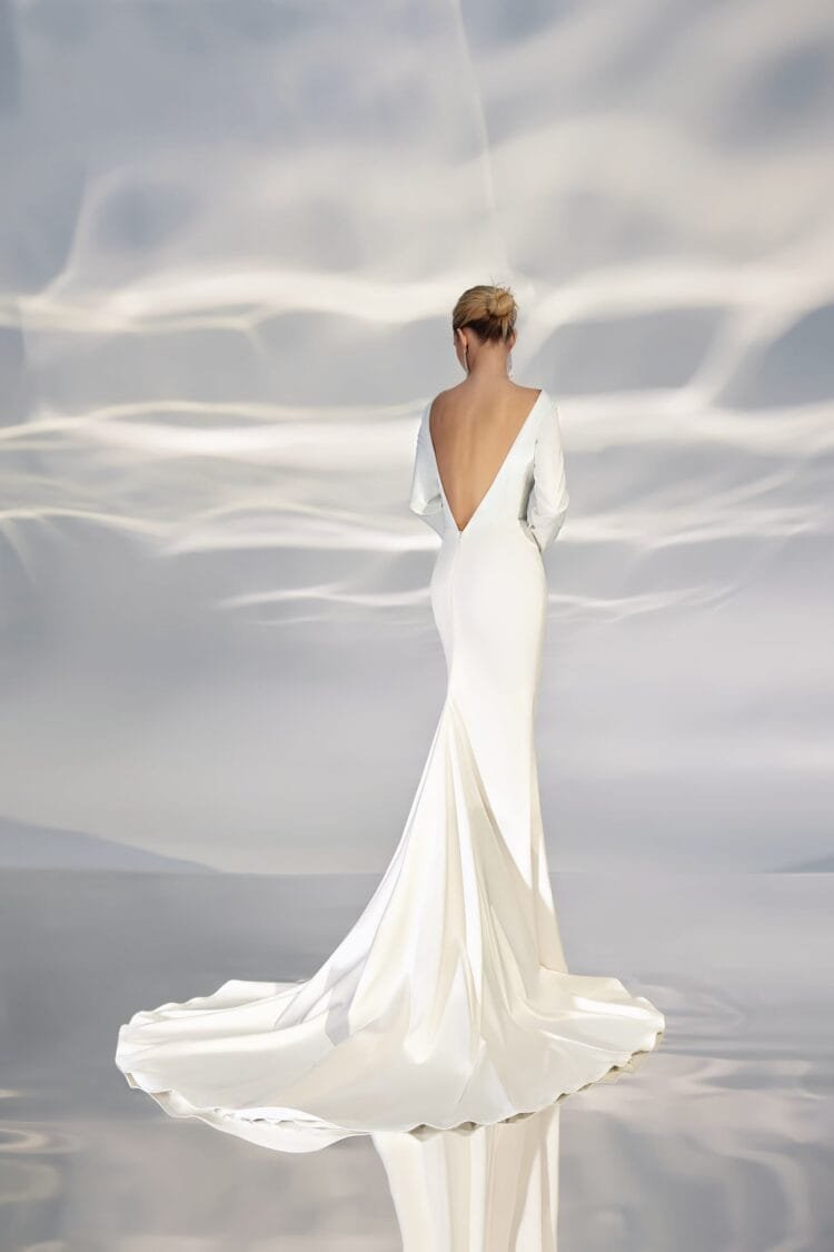 Sophisticated Minimalist A-Line Wedding Gown with Long Sleeves, Boat Neckline, and a Natural Waistline for an Elegant and Timeless Bridal Look