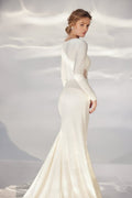 Alluring A-Line Wedding Gown with Long Sleeves, Boat Neckline, and a Natural Waistline for a Sophisticated and Sexy Bridal Look