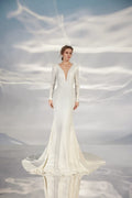 Ethereal A-Line Wedding Gown with Long Sleeves, V-Neckline, and a Natural Waistline for a Romantic and Timeless Bridal Look