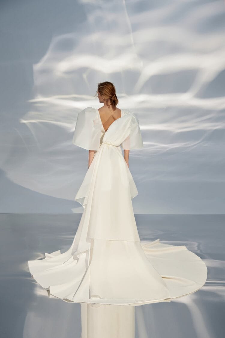 Contemporary Off-Shoulder A-Line Wedding Gown with Boat Neckline and a Natural Waistline for a Sophisticated Bridal Look