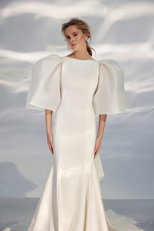 Contemporary Off-Shoulder A-Line Wedding Gown with Boat Neckline and a Natural Waistline for a Sophisticated Bridal Look