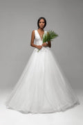 Beautiful Puffy A-Line Wedding Dress with Straps, V-Neckline, and Lace Embellishments for a Stunning Bridal Look