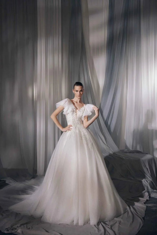 Elegant A-Line Puffy Bridal Gown with Illusion Sleeves, V-Neckline, Lace Embellishments, and Natural Waistline for a Stunning Look