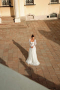 Elegant A-Line Puffy Bridal Gown with Long Sleeves, Boat Neckline, and Exquisite Lace Embellishments