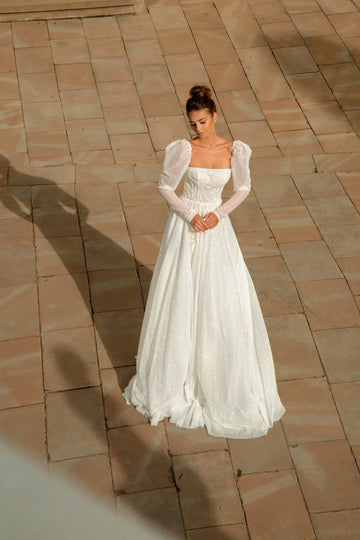 Elegant A-Line Puffy Bridal Gown with Long Sleeves, Boat Neckline, and Exquisite Lace Embellishments