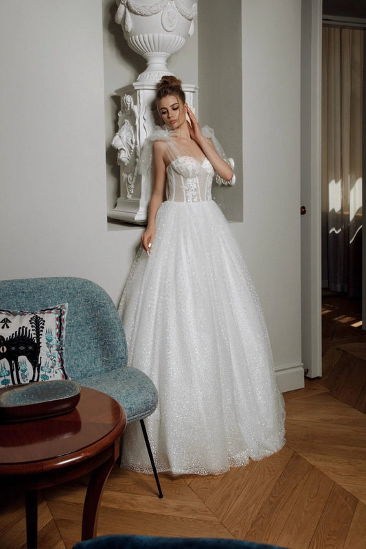 Elegant A-Line Puffy Wedding Dress with Sweetheart Neckline, Lace Embellishments, and Romantic Puff Sleeves