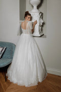 Elegant A-Line Puffy Wedding Dress with Sweetheart Neckline, Lace Embellishments, and Romantic Puff Sleeves