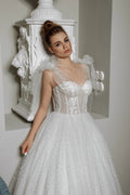 Elegant A-Line Puffy Wedding Dress with Sweetheart Neckline, Lace Embellishments, and Romantic Puff Sleeves