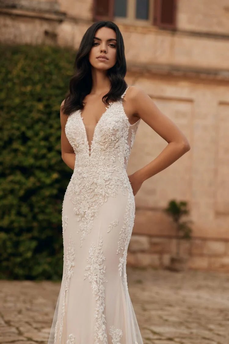 Elegant Sheath Wedding Dress with Strapless V-Neckline, and Natural Waistline for a Stunning Bridal Look