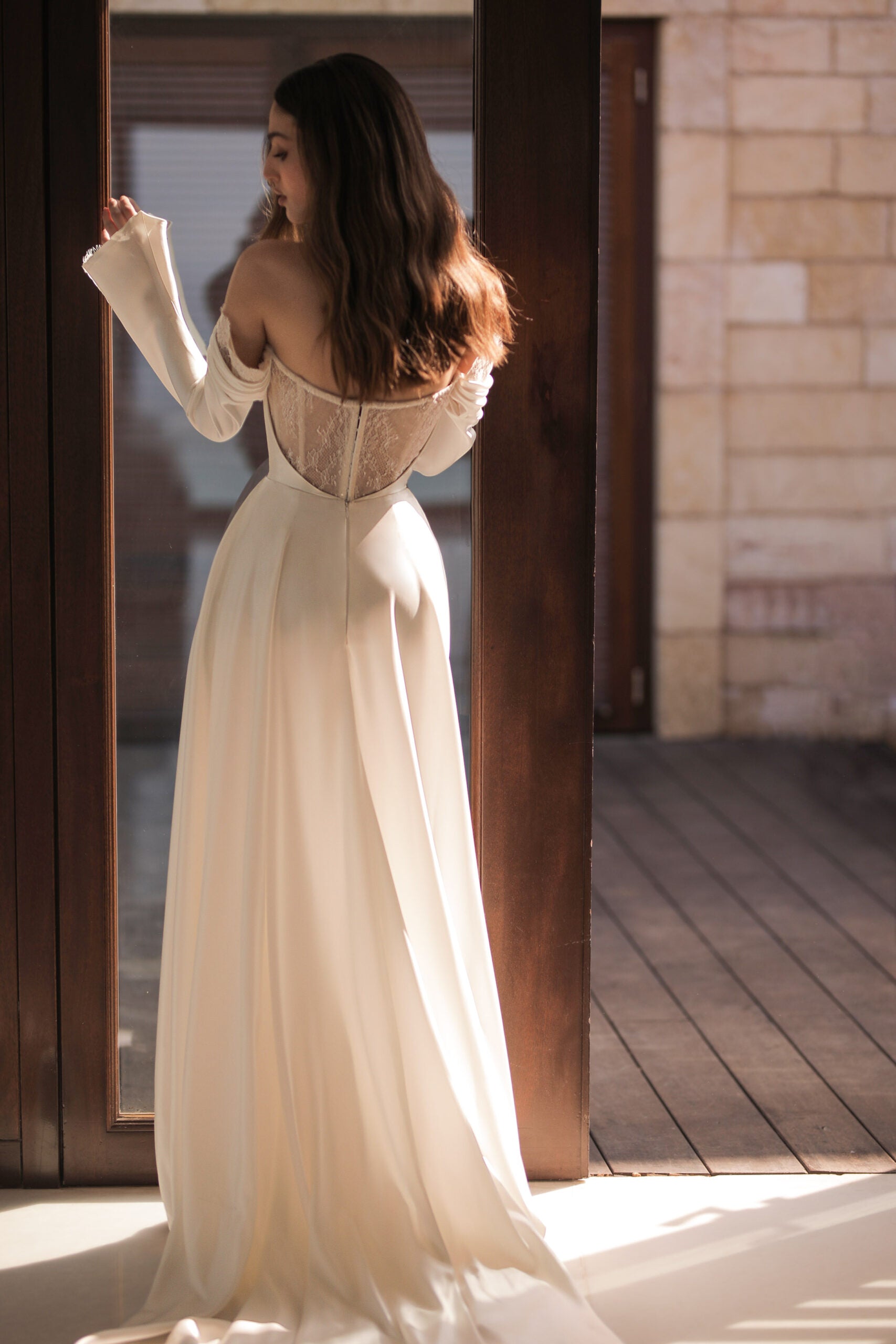 Elegant Sheath Wedding Gown with Sequin Lace, Off-Shoulder Neckline, and Long Sleeves for a Romantic and Timeless Bridal Look