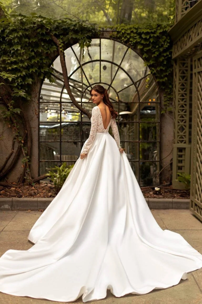 Timeless A-Line Wedding Gown with Long Sleeves, V-Neckline, and a Flattering Dropped Waist for an Elegant Bridal Look