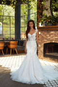 Elegant Mermaid Wedding Gown with Spaghetti Straps, Halter Neckline, and a Flattering Dropped Waist for a Captivating Bridal Look