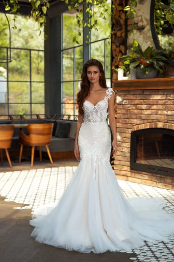 Elegant Mermaid Wedding Gown with Spaghetti Straps, Halter Neckline, and a Flattering Dropped Waist for a Captivating Bridal Look