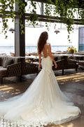 Elegant Mermaid Wedding Gown with Spaghetti Straps, Halter Neckline, and a Flattering Dropped Waist for a Captivating Bridal Look