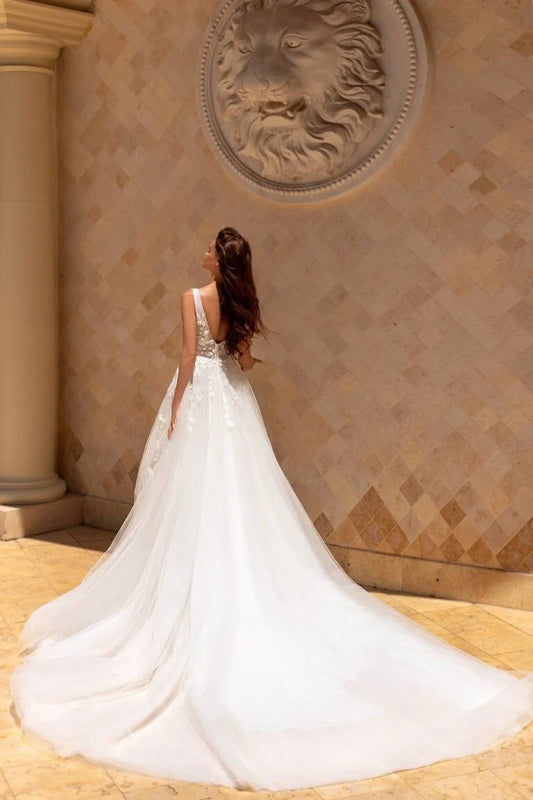 Majestic Ball Gown Wedding Dress with Cap Sleeves, V-Neckline, and a Flattering Dropped Waist for a Fairytale Bridal Look