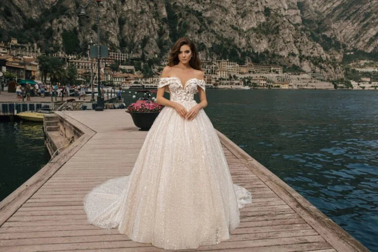 Regal Ball Gown Wedding Dress with Off-the-Shoulder Design, Queen Anne Neckline, and a Flattering Natural Waistline for a Stunning Bridal Look