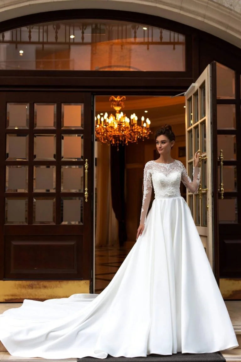 Graceful A-Line Wedding Gown with Long Sleeves, High-Neckline, and a Flattering Dropped Waist for a Timeless and Elegant Bridal Look