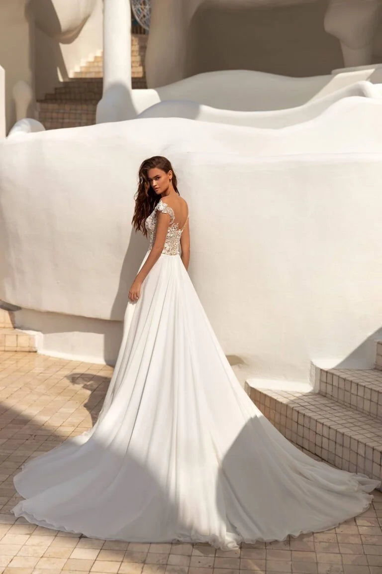 Timeless A-Line Wedding Gown with Off-Shoulder Neckline, Delicate Lace Details, and a Flattering Natural Waist for an Elegant Bridal Look