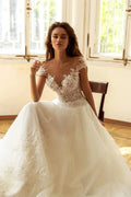 Graceful A-Line Wedding Gown with Cap Sleeves, Off-Shoulder Neckline, and a Flattering Dropped Waist for a Romantic Bridal Look