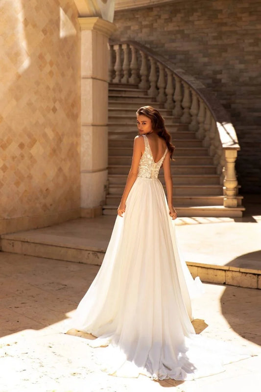 Ethereal A-Line Wedding Gown with Spaghetti Straps, V-Neckline, and a Flattering Natural Waist for a Graceful Bridal Look