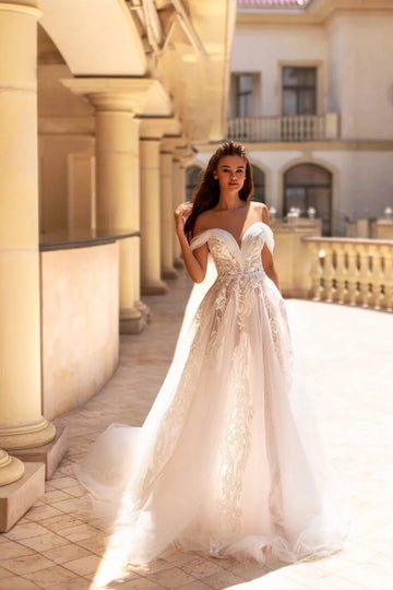 Romantic A-Line Wedding Gown with Off-Shoulder Neckline, Delicate Lace Details, and a Flattering Dropped Waist for a Timeless Bridal Look