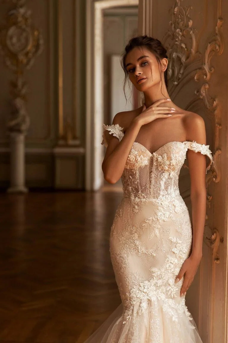 Glamorous Mermaid Wedding Gown with Off-Shoulder Sweetheart Neckline, Delicate Lace Details, and a Flattering Dropped Waist for a Breathtaking Bridal Look