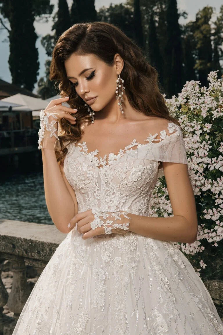 Majestic Ball Gown Wedding Dress with Elegant Long Sleeves, Off-Shoulder Neckline, and a Flattering Natural Waistline for a Breathtaking Bridal Look