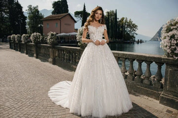 Majestic Ball Gown Wedding Dress with Elegant Long Sleeves, Off-Shoulder Neckline, and a Flattering Natural Waistline for a Breathtaking Bridal Look