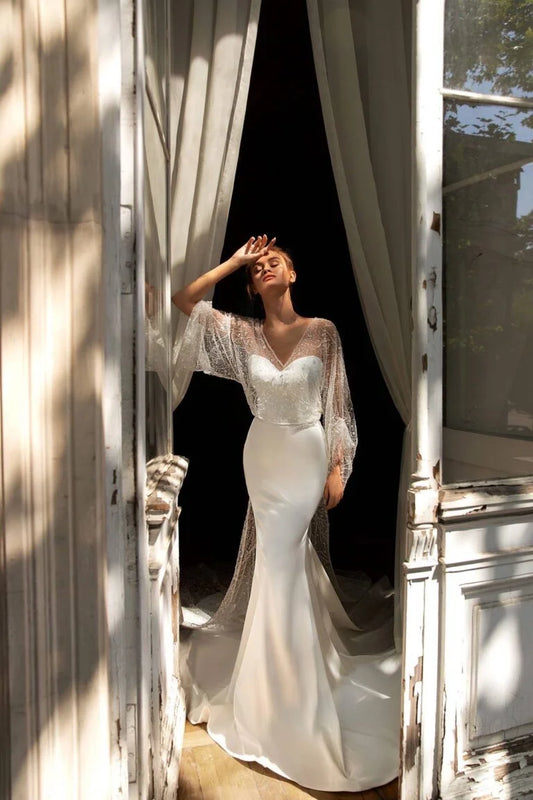 Stunning Mermaid Wedding Gown with Long Sleeves, V-Neckline, and a Flattering Natural Waist for an Elegant Bridal Look