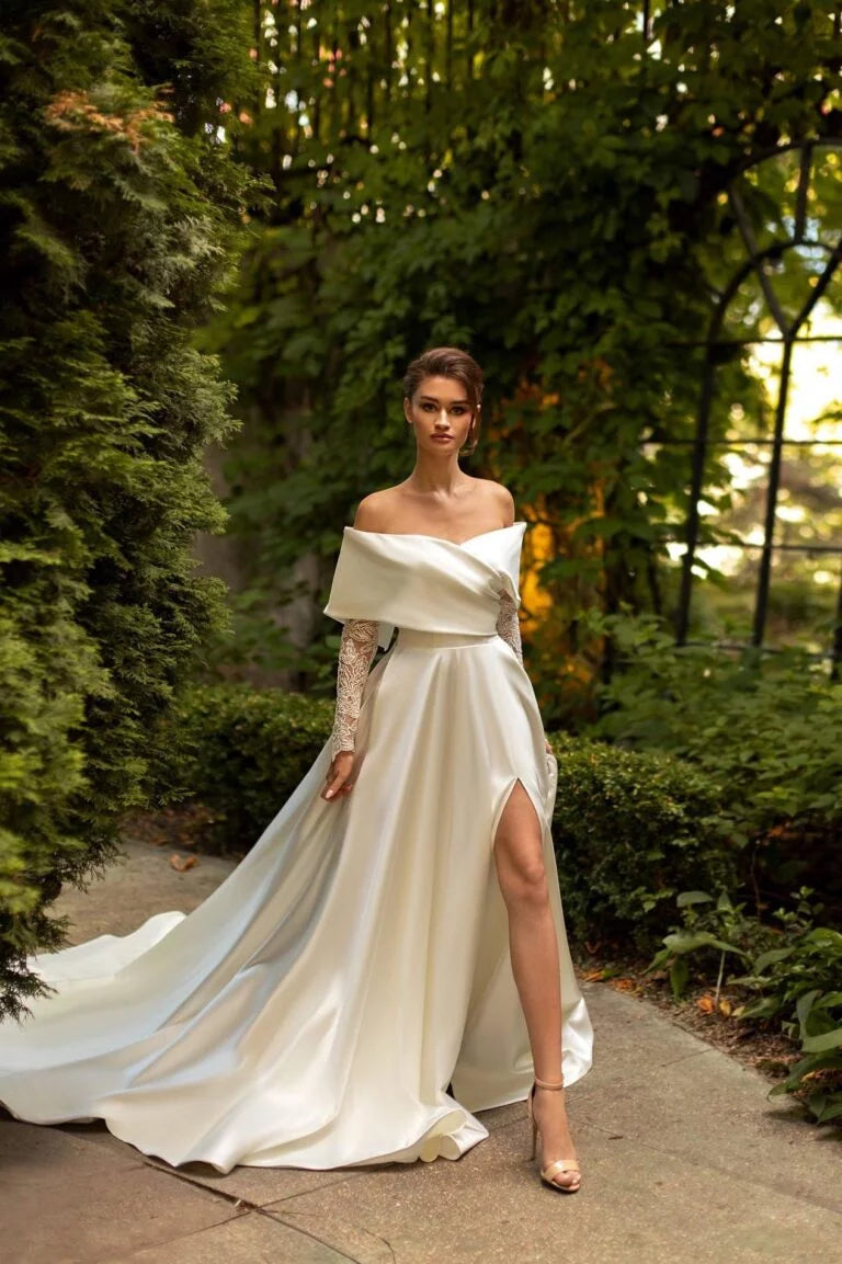 Exquisite A-Line Wedding Gown with Off-Shoulder Neckline, Long Sleeves, and a Flattering Dropped Waist for a Romantic Bridal Look