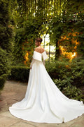 Exquisite A-Line Wedding Gown with Off-Shoulder Neckline, Long Sleeves, and a Flattering Dropped Waist for a Romantic Bridal Look