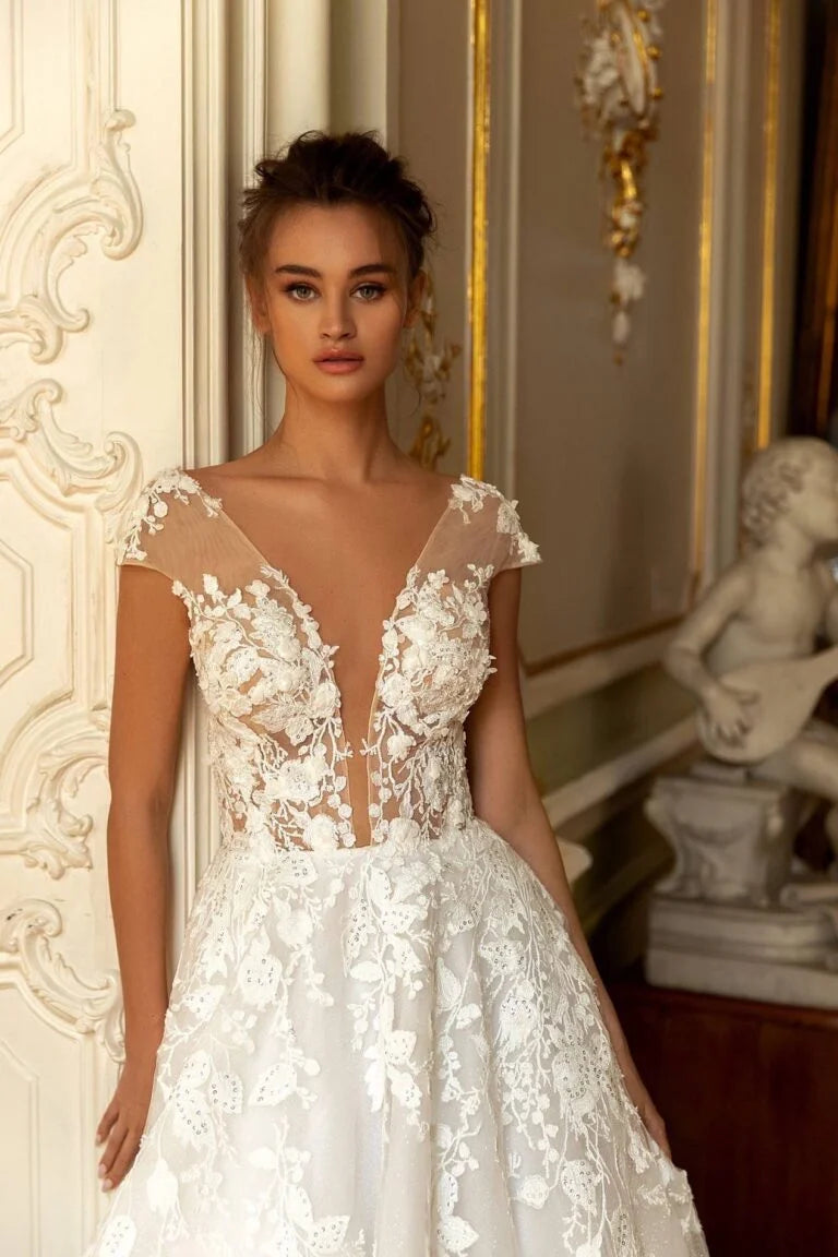 Romantic A-Line Wedding Gown with Long Sleeves, V-Neckline, and a Graceful Dropped Waist for an Enchanting Bridal Look